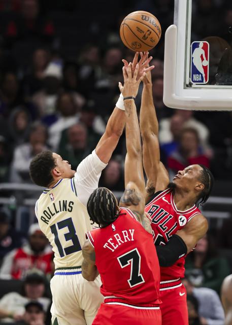 (260204) -- MILWAUKEE, Feb. 4, 2026 (Xinhua) -- Milwaukee Bucks' Ryan Rollins (L) drives to the basket as Chicago Bulls' Dalen Terry (C) and Isaac Okoro defend during the 2025-2026 NBA regular season basketball game between Milwaukee Bucks and Chicago Bulls in Milwaukee, the United States, on Feb. 3, 2026. (Photo by Joel Lerner/Xinhua)