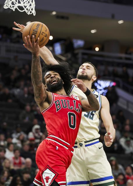 (260204) -- MILWAUKEE, Feb. 4, 2026 (Xinhua) -- Chicago Bulls' Coby White (L) drives to the basket against Milwaukee Bucks' Pete Nance during the 2025-2026 NBA regular season basketball game between Milwaukee Bucks and Chicago Bulls in Milwaukee, the United States, on Feb. 3, 2026. (Photo by Joel Lerner/Xinhua)
