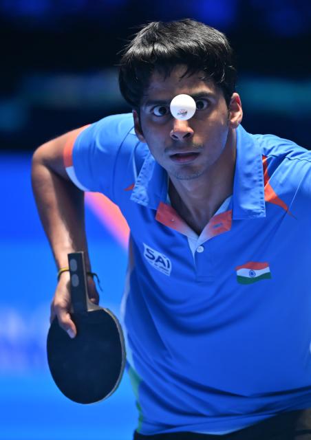(260204) -- HAIKOU, Feb. 4, 2026 (Xinhua) -- Snehit Suravajjula serves during the men's singles group match between Lin Shidong of China and Snehit Suravajjula of India at the ITTF-ATTU Asian Cup Haikou 2025 table tennis tournament in Haikou, south China's Hainan Province, Feb. 4, 2026. (Xinhua/Guo Cheng)