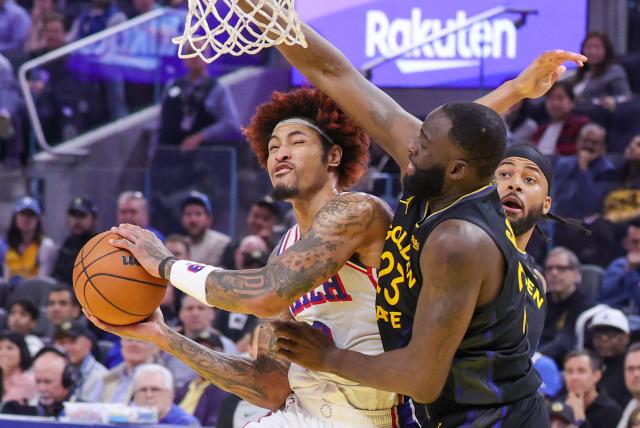 (260204) -- SAN FRANCISCO, Feb. 4, 2026 (Xinhua) -- Kelly Oubre Jr. (L) of Philadelphia 76ers competes during the 2025-2026 NBA regular season basketball game between Golden State Warriors and Philadelphia 76ers in San Francisco, the United States, Feb. 3, 2026. (Photo by Arthur Dong/Xinhua)