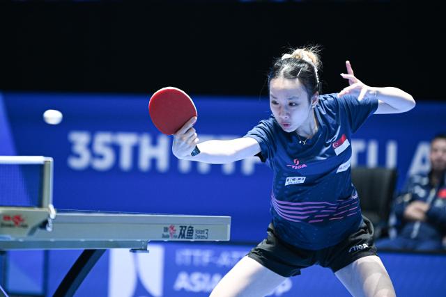 (260204) -- HAIKOU, Feb. 4, 2026 (Xinhua) -- Ser Lin Qian hits a return during the women's singles group match between Wang Yidi of China and Ser Lin Qian of Singapore at the ITTF-ATTU Asian Cup Haikou 2025 table tennis tournament in Haikou, south China's Hainan Province, Feb. 4, 2026. (Xinhua/Pu Xiaoxu)