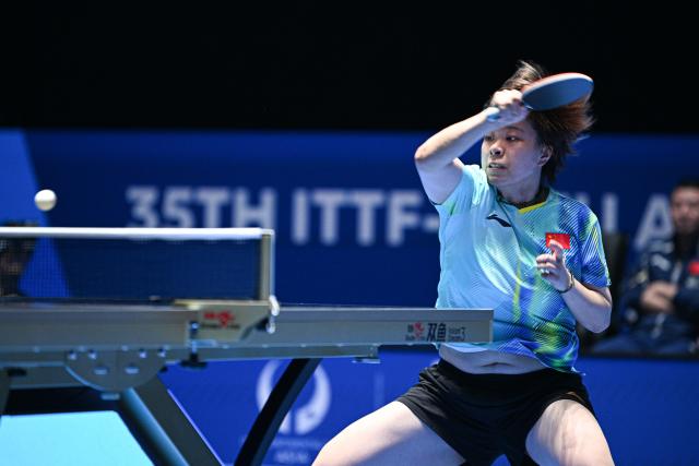 (260204) -- HAIKOU, Feb. 4, 2026 (Xinhua) -- Wang Yidi hits a return during the women's singles group match between Wang Yidi of China and Ser Lin Qian of Singapore at the ITTF-ATTU Asian Cup Haikou 2025 table tennis tournament in Haikou, south China's Hainan Province, Feb. 4, 2026. (Xinhua/Pu Xiaoxu)