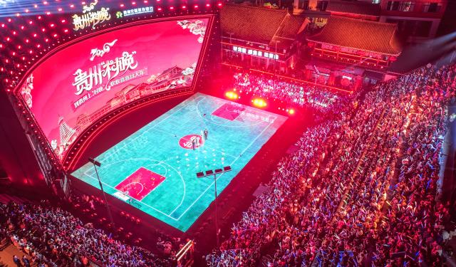 (260204) -- TAIJIANG, Feb. 4, 2026 (Xinhua) -- An aerial drone photo shows people watching a "village gala" in Taipan Village of Taijiang County, southwest China's Guizhou Province, Feb. 3, 2026.
  A "village gala" was held at the court of the "Village Basketball Association (Village BA)" in Taijiang County Tuesday night, which featured various folk performances staged by local villagers. 
  "Village Basketball Association" or "Village BA", is a grassroot basketball tournament held in Taipan Village. Organized by local residents, this event has gained popularity over the years and draws a large crowd of spectators and participants alike. (Xinhua/Yang Wenbin)