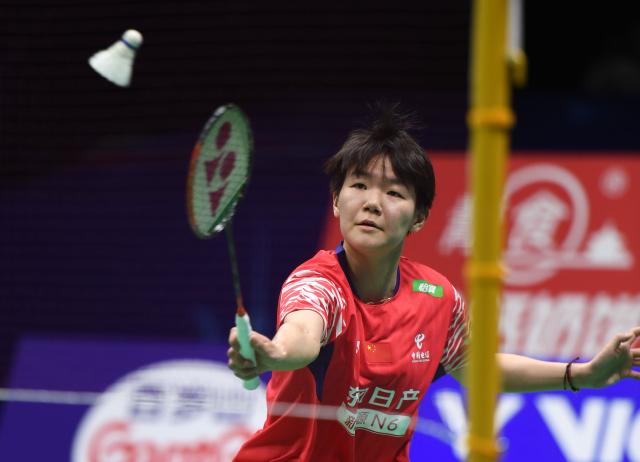 (260204) -- QINGDAO, Feb. 4, 2026 (Xinhua) -- Han Qianxi of China hits a return in the women's singles match against Karupathevan Letshanaa of Malaysia during the women's team Group W match between China and Malaysia at Badminton Asia Team Championships 2026 in Qingdao, east China's Shandong Province, Feb. 4, 2026. (Xinhua/Li Ziheng)