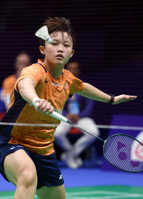 (260204) -- QINGDAO, Feb. 4, 2026 (Xinhua) -- Wong Ling Ching of Malaysia hits a return in the women's singles match against Xu Wenjing of China during the women's team Group W match between China and Malaysia at Badminton Asia Team Championships 2026 in Qingdao, east China's Shandong Province, Feb. 4, 2026. (Xinhua/Li Ziheng)