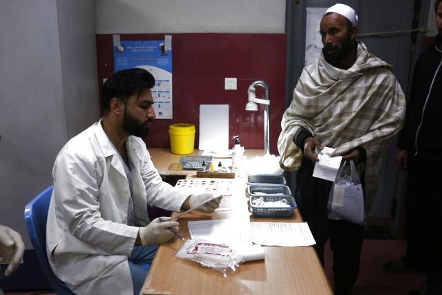 (260204) -- KABUL, Feb. 4, 2026 (Xinhua) -- A patient (R) consults a doctor for blood disorders at a public blood disease treatment center in Kabul, capital of Afghanistan, Jan. 28, 2026.
  This hospital is Afghanistan's only public center dedicated to treating blood disorders and leukemia. For thousands of families with limited resources, it has become a fragile lifeline.
   TO GO WITH "Feature: Afghanistan's only public blood disease treatment center offers hope despite challenges" (Photo by Saifurahman/Xinhua)