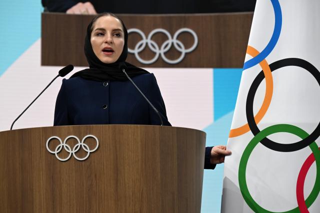 (260204) -- MILAN, Feb. 4, 2026 (Xinhua) -- Iranian badminton player Soraya Aghaei Hajiagha speaks during her oath ceremony as the newly appointed member of International Olympic Committee (IOC) at the 145th IOC session ahead of the 2026 Milan-Cortina Winter Olympic Games, in Milan, Italy, Feb. 4, 2026. (Daniel Munoz/POOL xia Xinhua)