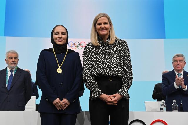 (260204) -- MILAN, Feb. 4, 2026 (Xinhua) -- Iranian badminton player Soraya Aghaei Hajiagha (2nd L) poses with International Olympic Committee (IOC) President Kirsty Coventry (2nd R) during her oath ceremony as the newly appointed member of IOC at the 145th IOC session ahead of the 2026 Milan-Cortina Winter Olympic Games, in Milan, Italy, Feb. 4, 2026. (Daniel Munoz/POOL xia Xinhua)