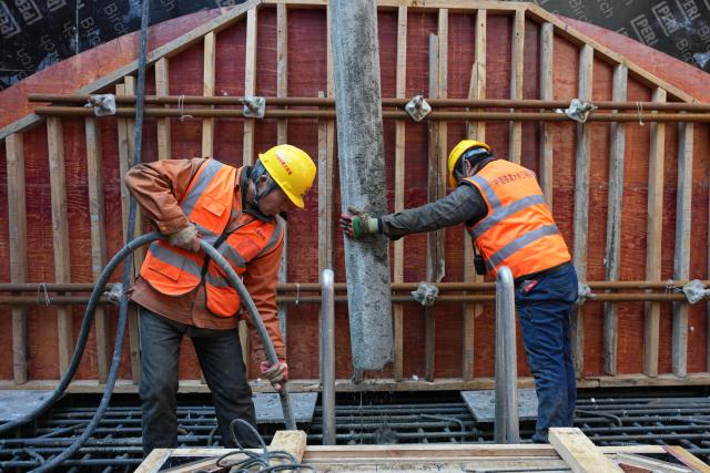 (260204) -- ZHOUSHAN, Feb. 4, 2026 (Xinhua) -- Workers carry out their duties on the No. 6 main tower of the Taoyaomen highway-railway bridge in Zhoushan, east China's Zhejiang Province, Feb. 4, 2026. The No. 6 main tower of the Taoyaomen highway-railway bridge, constructed by the China Railway Major Bridge Engineering Group Co., Ltd., was topped out on Wednesday, marking a significant breakthrough of this project. (Xinhua/Huang Zongzhi)