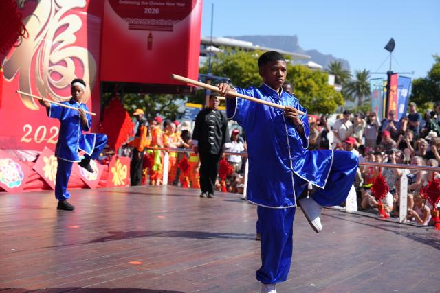 (260204) -- CAPE TOWN, Feb. 4, 2026 (Xinhua) -- People perform Chinese martial arts during an event in celebration of the Chinese New Year in Cape Town, South Africa, on Feb. 1, 2026. The bustling Victoria & Alfred Waterfront in Cape Town, South Africa's legislative capital, came alive with vibrant colors and lively performances on Sunday as the upcoming Chinese New Year was celebrated.
   The event attracted hundreds of local residents and foreign tourists, injecting fresh momentum into people-to-people exchanges between China and Africa.
   TO GO WITH "Feature: Chinese New Year celebrated in Cape Town in a boost to people-to-people exchanges" (Xinhua/Wang Lei)