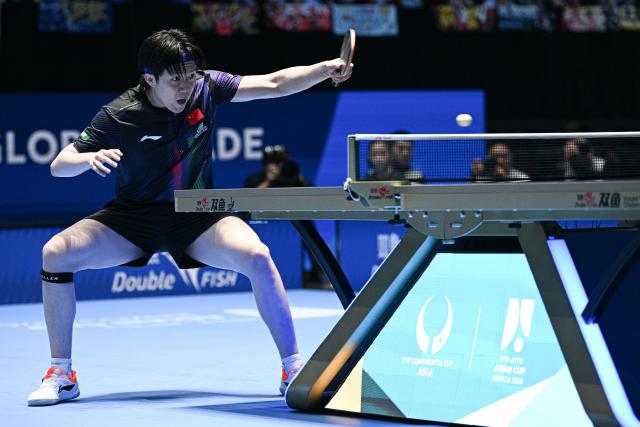 (260204) -- HAIKOU, Feb. 4, 2026 (Xinhua) -- Wang Chuqin hits a return during the men's singles group match between Wang Chuqin of China and Akash Pal of India at the ITTF-ATTU Asian Cup Haikou 2026 table tennis tournament in Haikou, south China's Hainan Province, Feb. 4, 2026. (Xinhua/Pu Xiaoxu)