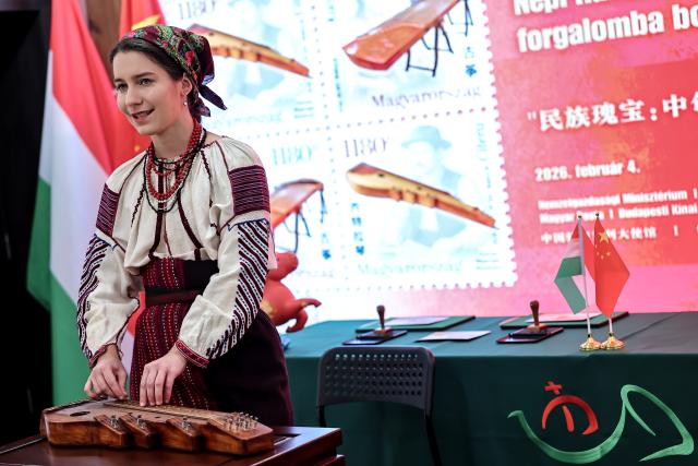 (260204) -- BUDAPEST, Feb. 4, 2026 (Xinhua) -- An artist performs a zither solo at a launch ceremony of the "National Treasures: Traditional Hungarian and Chinese Instruments" stamps in Budapest, Hungary, on Feb. 4, 2026. Hungary and China on Wednesday jointly issued a commemorative stamp series titled "National Treasures: Traditional Hungarian and Chinese Instruments" for the upcoming Chinese New Year. (Photo by David Balogh/Xinhua)