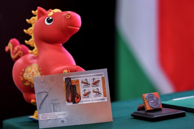(260204) -- BUDAPEST, Feb. 4, 2026 (Xinhua) -- This photo taken on Feb. 4, 2026 shows the "National Treasures: Traditional Hungarian and Chinese Instruments" stamps at a launch ceremony in Budapest, Hungary. Hungary and China on Wednesday jointly issued a commemorative stamp series titled "National Treasures: Traditional Hungarian and Chinese Instruments" for the upcoming Chinese New Year. (Photo by David Balogh/Xinhua)