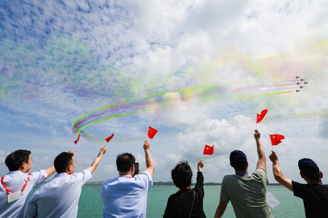 (260204) -- SINGAPORE, Feb. 4, 2026 (Xinhua) -- Aircraft of the Bayi Aerobatic Team of the Chinese People's Liberation Army (PLA) Air Force perform during the 10th Singapore Airshow in Singapore, Feb. 4, 2026. The 10th Singapore Airshow opened on Tuesday at the Changi Exhibition Center. The airshow runs until Feb. 8, with the Bayi Aerobatic Team of the Chinese People's Liberation Army (PLA) Air Force delivering flight displays. (Photo by Zhu Jianghai/Xinhua)