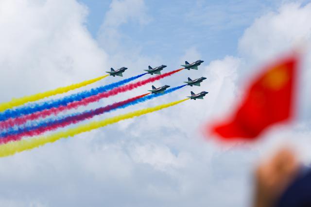 (260204) -- SINGAPORE, Feb. 4, 2026 (Xinhua) -- Aircraft of the Bayi Aerobatic Team of the Chinese People's Liberation Army (PLA) Air Force perform during the 10th Singapore Airshow in Singapore, Feb. 4, 2026. The 10th Singapore Airshow opened on Tuesday at the Changi Exhibition Center. The airshow runs until Feb. 8, with the Bayi Aerobatic Team of the Chinese People's Liberation Army (PLA) Air Force delivering flight displays. (Photo by Zhu Jianghai/Xinhua)