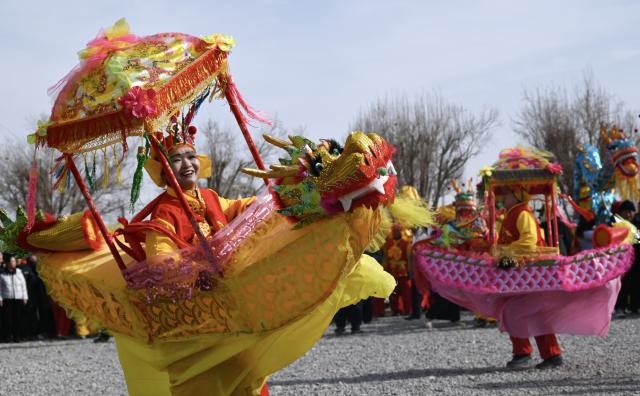 (260204) -- BEIJING, Feb. 4, 2026 (Xinhua) -- A folk performance is staged on the occasion of "Lichun" in Dunhuang, northwest China's Gansu Province, on Feb. 4, 2026. Wednesday marks "Lichun," or the Beginning of Spring, the first of the 24 solar terms on the Chinese lunar calendar. (Photo by Zhang Xiaoliang/Xinhua)