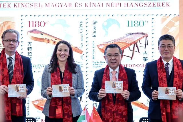 (260204) -- BUDAPEST, Feb. 4, 2026 (Xinhua) -- Chinese Ambassador to Hungary Gong Tao (2nd R) and Aniko Turi, secretary of state at the Ministry for National Economy (2nd L), display the "National Treasures: Traditional Hungarian and Chinese Instruments" stamps at a launch ceremony in Budapest, Hungary, on Feb. 4, 2026. Hungary and China on Wednesday jointly issued a commemorative stamp series titled "National Treasures: Traditional Hungarian and Chinese Instruments" for the upcoming Chinese New Year. (Photo by David Balogh/Xinhua)