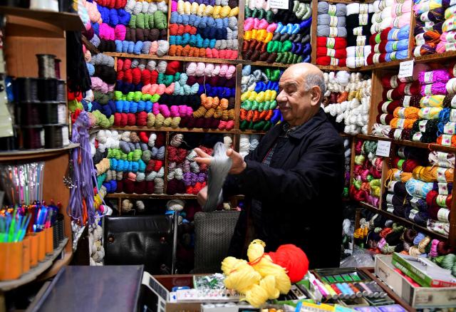 (260205) -- DAMASCUS, Feb. 5, 2026 (Xinhua) -- A store owner waits for customers at the Souq al-Khayyatin market in Damascus, Syria, Feb. 4, 2026. This historic market is traditionally known for tailoring, fabrics and clothing trade. (Photo by Ammar Safarjalani/Xinhua)