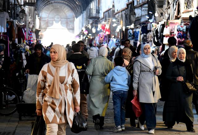 (260205) -- DAMASCUS, Feb. 5, 2026 (Xinhua) -- People visit the Souq al-Khayyatin market in Damascus, Syria, Feb. 4, 2026. This historic market is traditionally known for tailoring, fabrics and clothing trade. (Photo by Ammar Safarjalani/Xinhua)