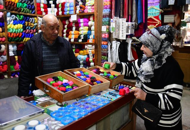 (260205) -- DAMASCUS, Feb. 5, 2026 (Xinhua) -- A woman shops at a store of the Souq al-Khayyatin market in Damascus, Syria, Feb. 4, 2026. This historic market is traditionally known for tailoring, fabrics and clothing trade. (Photo by Ammar Safarjalani/Xinhua)