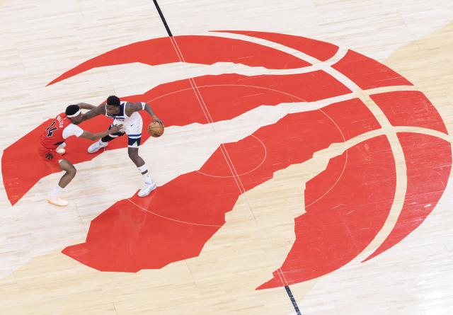 (260205) -- TORONTO, Feb. 5, 2026 (Xinhua) -- Anthony Edwards (R) of Minnesota Timberwolves dribbles during the 2025-2026 NBA regular season game between Toronto Raptors and Minnesota Timberwolves in Toronto, Canada, on Feb. 4, 2026. (Photo by Zou Zheng/Xinhua)