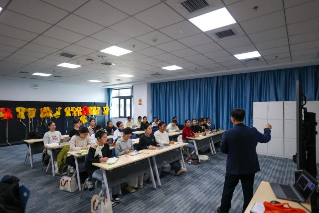(260205) -- TIANJIN, Feb. 5, 2026 (Xinhua) -- Flight attendant trainees from Thailand take a class of cabin safety and management at the Civil Aviation University of China (CAUC) in Tianjin, north China, on Jan. 8, 2026. Yanatchara Anukun, 21, is among 28 flight attendant trainees from Thailand's Suan Dusit University (SDU), who completed a three-month study of cabin safety and management, as well as psychology of cabin service at the CAUC in Tianjin. The study is part of an aviation business exchange cooperation between CAUC and SDU. Besides that, the trainees also received practical training in a cabin simulator here to handle emergency situations in real life.  
    In October 2024, Yanatchara Anukun, as a member of SDU's teacher-student exchange group, came to China and studied for a period of time, an experience that deepened her understanding of civil aviation education and training systems of China's universities. In 2025, she once again gained the chance to China for a short-term study and training in her major. "We practiced many times in the cabin simulator to learn how to deal with the situations that may occur suddenly during flight," said Yanatchara Anukun. For her, becoming a flight attendant is not only a career choice, but also a dream. (Xinhua/Sun Fanyue)