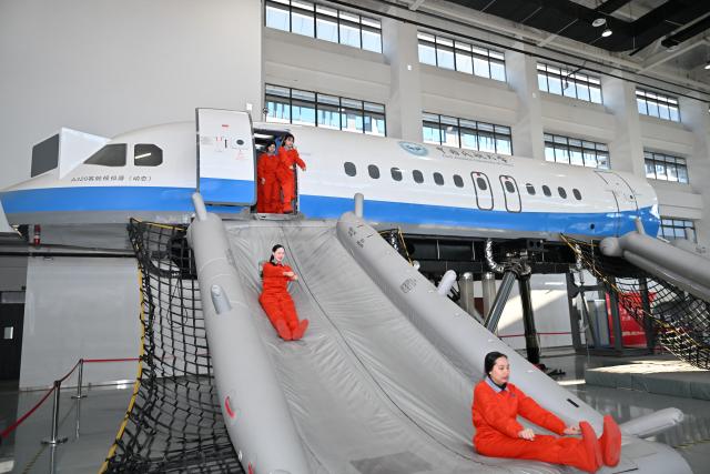 (260205) -- TIANJIN, Feb. 5, 2026 (Xinhua) -- Flight attendant trainees from Thailand take part in a training in a cabin simulator at the Civil Aviation University of China (CAUC) in Tianjin, north China, on Jan. 20, 2026. Yanatchara Anukun, 21, is among 28 flight attendant trainees from Thailand's Suan Dusit University (SDU), who completed a three-month study of cabin safety and management, as well as psychology of cabin service at the CAUC in Tianjin. The study is part of an aviation business exchange cooperation between CAUC and SDU. Besides that, the trainees also received practical training in a cabin simulator here to handle emergency situations in real life.  
    In October 2024, Yanatchara Anukun, as a member of SDU's teacher-student exchange group, came to China and studied for a period of time, an experience that deepened her understanding of civil aviation education and training systems of China's universities. In 2025, she once again gained the chance to China for a short-term study and training in her major. "We practiced many times in the cabin simulator to learn how to deal with the situations that may occur suddenly during flight," said Yanatchara Anukun. For her, becoming a flight attendant is not only a career choice, but also a dream. (Xinhua/Sun Fanyue)