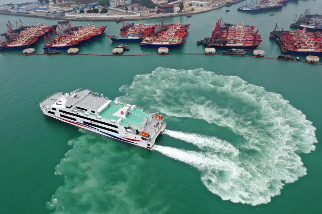 (260205) -- BEIHAI, Feb. 5, 2026 (Xinhua) -- An aerial drone photo shows the Beiyou 36 passenger ship departing from Beihai international port and heading for Weizhou Island in Beihai, south China's Guangxi Zhuang Autonomous Region, Feb. 5, 2026. Beiyou 36, the 1,200-seat high-speed passenger ship newly put into operation in Baihai for the Spring Festival travel rush, has a total length of 71 meters, a designed speed of 29 knots, and a maximum speed of over 32 knots. (Xinhua/Lu Boan)