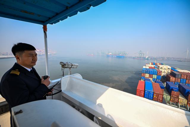 (260205) -- TIANJIN, Feb. 5, 2026 (Xinhua) -- Sun Bo guides a cargo ferry to depart from Tianjin Port in Tianjin, north China, Feb. 4, 2026.
  Sun Bo and Xu Qinping are both port pilots at Tianjin Port. A port pilot needs to be familiar not only with the port's navigation conditions, but also with vessel maneuvering skills. Working around the clock across navigation channels, berthing locations and anchorage grounds, they are responsible for the safe arrival and departure of ships at the port. 
  "When guiding the anchoring of a vessel weighing hundreds of thousands of tons, we must maneuver with centimeter-level precision," said Sun Bo. According to him, the most dangerous part is embarking from the anchorage, when a pilot must choose the right moment to climb up a soft ladder. A single moment of carelessness could lead to a fall into the sea. Moreover, port pilots work year-round without breaks, with the daily ship schedule dictating their routine. 
  Over his 22-year career, Sun Bo has piloted more than 4,500 vessels and also witnessed the rapid development of China's ports and foreign trade. (Xinhua/Zhao Zishuo)
