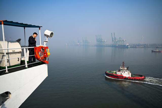 (260205) -- TIANJIN, Feb. 5, 2026 (Xinhua) -- Sun Bo on a cargo ferry guides a tugboat at Tianjin Port in Tianjin, north China, Feb. 4, 2026.
  Sun Bo and Xu Qinping are both port pilots at Tianjin Port. A port pilot needs to be familiar not only with the port's navigation conditions, but also with vessel maneuvering skills. Working around the clock across navigation channels, berthing locations and anchorage grounds, they are responsible for the safe arrival and departure of ships at the port. 
  "When guiding the anchoring of a vessel weighing hundreds of thousands of tons, we must maneuver with centimeter-level precision," said Sun Bo. According to him, the most dangerous part is embarking from the anchorage, when a pilot must choose the right moment to climb up a soft ladder. A single moment of carelessness could lead to a fall into the sea. Moreover, port pilots work year-round without breaks, with the daily ship schedule dictating their routine. 
  Over his 22-year career, Sun Bo has piloted more than 4,500 vessels and also witnessed the rapid development of China's ports and foreign trade. (Xinhua/Zhao Zishuo)