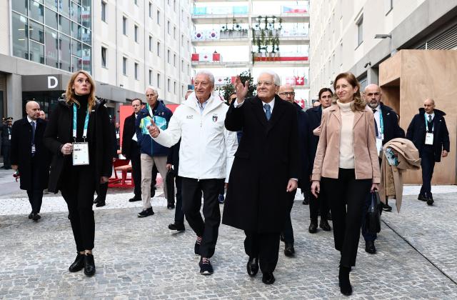 (260205) -- MILAN, Feb. 5, 2026 (Xinhua) -- Italian President Sergio Mattarella and his daughter Laura Mattarella and the President of the Italian National Olympic Committee (CONI) Luciano Buonfiglio visit the Olympic Village ahead of the 2026 Milan-Cortina Winter Olympics in Milan, Italy, Feb. 5, 2026. (Yara Nardi/Pool via Xinhua)