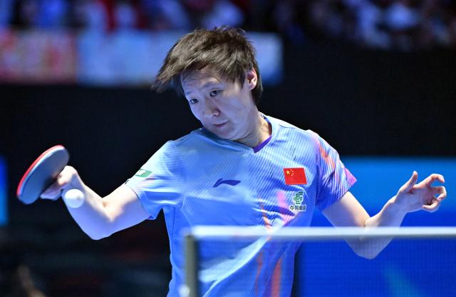 (260205) -- HAIKOU, Feb. 5, 2026 (Xinhua) -- Wang Manyu hits a return during the women's singles group match between Wang Manyu of China and Akae Kaho of Japan at the ITTF-ATTU Asian Cup Haikou 2026 table tennis tournament in Haikou, south China's Hainan Province, Feb. 5, 2026. (Xinhua/Guo Cheng)