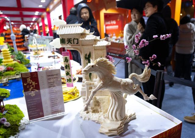 (260205) -- WUHAN, Feb. 5, 2026 (Xinhua) -- Consumers visit an event themed on the "Hubei New Spring International Consumption Season" in Wuhan, central China's Hubei Province, Feb. 5, 2026. The "Hubei New Spring International Consumption Season" kicked off here on Thursday, attempting to create diverse consumption scenarios for the upcoming Spring Festival. (Xinhua/Xiao Yijiu)