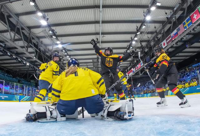 (260205) -- MILAN, Feb. 5, 2026 (Xinhua) -- Svenja Voigt (2nd R) of Germany celebrates her goal during the ice hockey women's preliminary round group B match between Sweden and Germany of the 2026 Milan-Cortina Winter Olympics in Milan, Italy, Feb. 5, 2026. (Xinhua/Sun Fei)