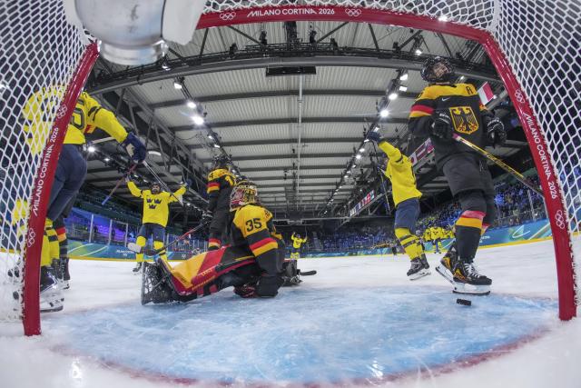 (260205) -- MILAN, Feb. 5, 2026 (Xinhua) -- Players of Sweden celebrate a goal during the ice hockey women's preliminary round group B match between Sweden and Germany of the 2026 Milan-Cortina Winter Olympics in Milan, Italy, Feb. 5, 2026. (Xinhua/Sun Fei)