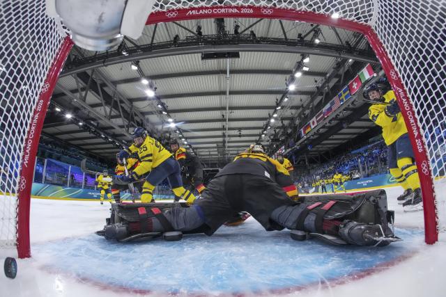 (260205) -- MILAN, Feb. 5, 2026 (Xinhua) -- Lina Ljungblom (3rd L) of Sweden shoots to score during the ice hockey women's preliminary round group B match between Sweden and Germany of the 2026 Milan-Cortina Winter Olympics in Milan, Italy, Feb. 5, 2026. (Xinhua/Sun Fei)
