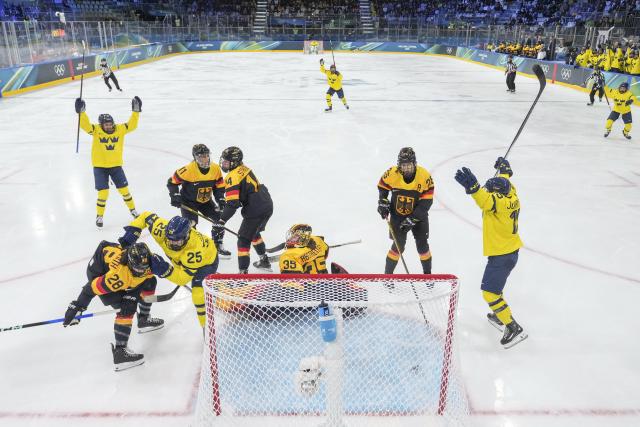 (260205) -- MILAN, Feb. 5, 2026 (Xinhua) -- Players of Sweden celebrate a goal during the ice hockey women's preliminary round group B match between Sweden and Germany of the 2026 Milan-Cortina Winter Olympics in Milan, Italy, Feb. 5, 2026. (Xinhua/Sun Fei)