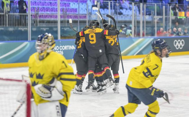 (260205) -- MILAN, Feb. 5, 2026 (Xinhua) -- Players of Germany celebrate a goal during the ice hockey women's preliminary round group B match between Sweden and Germany of the 2026 Milan-Cortina Winter Olympics in Milan, Italy, Feb. 5, 2026. (Xinhua/Sun Fei)