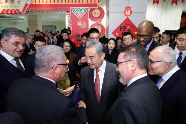 (260205) -- BEIJING, Feb. 5, 2026 (Xinhua) -- Chinese Foreign Minister Wang Yi, also a member of the Political Bureau of the Communist Party of China Central Committee, hosts the Chinese Foreign Ministry's 2026 New Year reception in Beijing, capital of China, Feb. 5, 2026. Nearly 500 people attended the event, including diplomatic envoys from various countries, representatives of international organizations in China, and representatives of Chinese government departments. (Xinhua/Liu Bin)