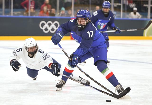 (260205) -- MILAN, Feb. 5, 2026 (Xinhua) -- Matilde Fantin (R) of Italy vies with Margot Huot-Marchand of France during the ice hockey women's preliminary round group B match between Italy and France of the Milan-Cortina 2026 Olympic Winter Games in Milan, Italy, Feb. 5, 2026. (Xinhua/Zhang Haofu)