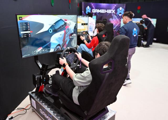 (260205) -- HAWALLI GOVERNORATE, Feb. 5, 2026 (Xinhua) -- People play games during a gaming festival in Hawalli Governorate, Kuwait, Feb. 5, 2026. The BASE Gaming Festival kicked off here on Thursday. (Photo by Asad/Xinhua)