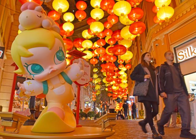 (260206) -- BEIJING, Feb. 6, 2026 (Xinhua) -- People walk along Lee Tung Street in Hong Kong, south China, on Feb. 5, 2026. Lanterns are hoisted to mark the upcoming Chinese New Year. (Xinhua/Chen Duo)
