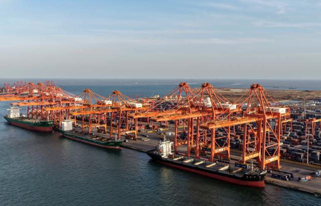 (260206) -- TANGSHAN, Feb. 6, 2026 (Xinhua) -- An aerial drone photo taken on Feb. 5, 2026 shows ships loading containers at a container dock of Tangshan Port in Tangshan, north China's Hebei Province. The foreign trade cargo throughput in Tangshan Port reached 381.56 million tonnes in 2025, up 2.59 percent year on year. (Xinhua/Yang Shiyao)