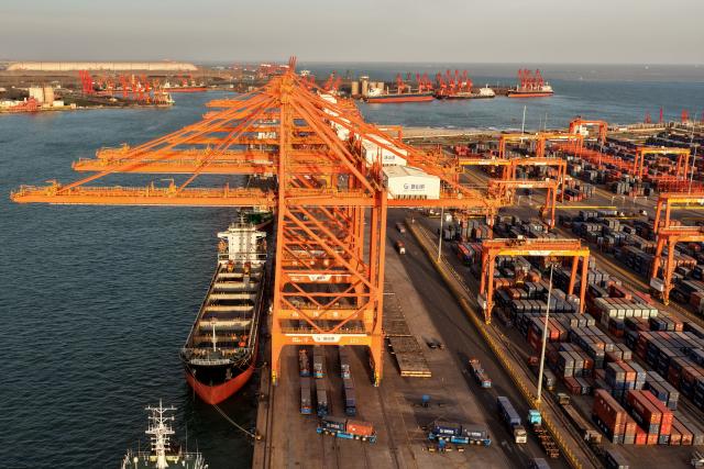 (260206) -- TANGSHAN, Feb. 6, 2026 (Xinhua) -- An aerial drone photo taken on Feb. 5, 2026 shows ships loading containers at a container dock of Tangshan Port in Tangshan, north China's Hebei Province. The foreign trade cargo throughput in Tangshan Port reached 381.56 million tonnes in 2025, up 2.59 percent year on year. (Xinhua/Yang Shiyao)
