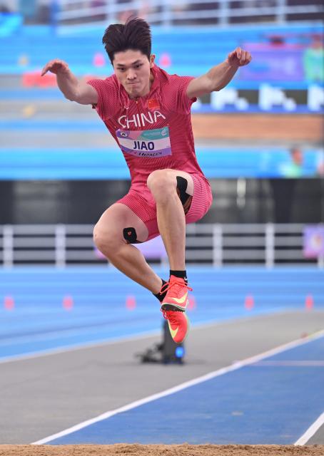 (260206) -- TIANJIN, Feb. 6, 2026 (Xinhua) -- China's Jiao Xinping competes during the men's triple jump final at the 12th Asian Indoor Athletics Championships 2026 in Tianjin, north China, Feb. 6, 2026. (Xinhua/Li Ran)