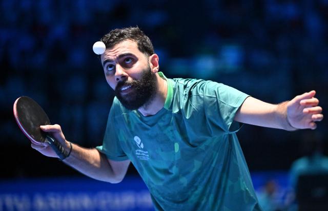 (260206) -- HAIKOU, Feb. 6, 2026 (Xinhua) -- Abdulaziz Bu Shulaybi serves during the men's singles group match between Lin Shidong of China and Abdulaziz Bu Shulaybi of Saudi Arabia at the ITTF-ATTU Asian Cup Haikou 2026 table tennis tournament in Haikou, south China's Hainan Province, Feb. 6, 2026. (Xinhua/Guo Cheng)