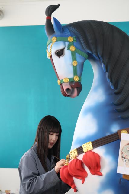 (260206) -- TIANJIN, Feb. 6, 2026 (Xinhua) -- An artist paints a clay sculpture at the Tianjin Clay Figurine Zhang Painted Sculpture Working Office in Tianjin, north China, Feb. 5, 2026. The Tianjin Clay Figurine Zhang Painted Sculpture Working Office has recently designed and created a series of painted sculptures themed on the Year of the Horse to greet the Chinese New Year. These artworks will be part of a Year of the Horse themed exhibition at the Tianjin Museum, which will be be open to the public free of charge during the Spring Festival. (Xinhua/Sun Fanyue)