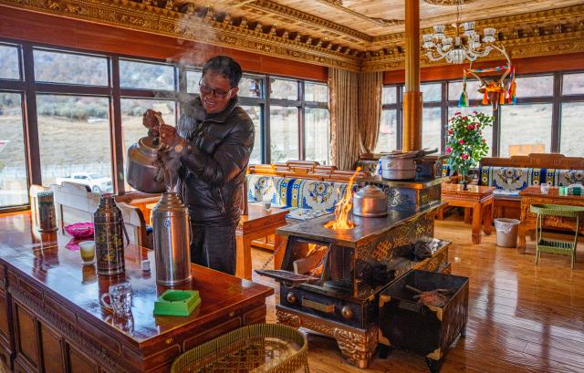 (260206) -- SHANNAN, Feb. 6, 2026 (Xinhua) -- A villager works at his home-stay in Yumai Town of Lhunze County in Shannan City, southwest China's Xizang Autonomous Region, Feb. 5, 2026. Yumai Town, located on the southern foot of the Himalayas, was once home to merely three permanent residents due to its harsh and rugged terrain. Today, residential houses here are neatly arranged, with comprehensive infrastructure including drainage and communication facilities in place. 
   Schools, health clinics, and hotels have also been established, alongside with home-stays, small shops, and courier stations operated by villagers.
   In 2025, the area received over 12,000 tourists, with home-stay income exceeding 284,200 yuan. (Xinhua/Tenzin Nyida)