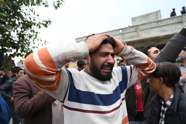 (260206) -- ISLAMABAD, Feb. 6, 2026 (Xinhua) -- A man grieves outside a mosque where an explosion took place in Islamabad, capital of Pakistan, on Feb. 6, 2026. At least 31 people were killed and around 170 others were injured after an explosion ripped through a mosque during Friday prayers in Pakistan's federal capital city of Islamabad, police and government officials said. (Xinhua/Ahmad Kamal)
