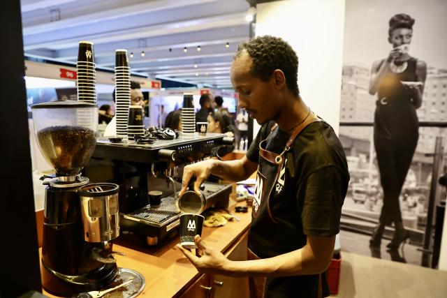 (260206) -- ADDIS ABABA, Feb. 6, 2026 (Xinhua) -- A barista makes coffee for visitors during the 22nd African Fine Coffees Conference and Exhibition in Addis Ababa, Ethiopia, Feb. 6, 2026. The 22nd African Fine Coffees Conference and Exhibition, running from February 4 to 6, 2026, has brought together producers, exporters, traders, roasters, investors, policymakers, and development partners to promote African coffee excellence and strengthen global market linkages. (Xinhua/Geng Xinning)